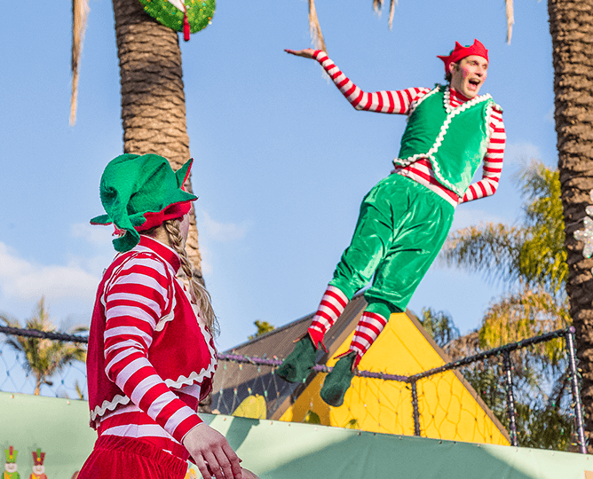 Acrobats in elf costumes