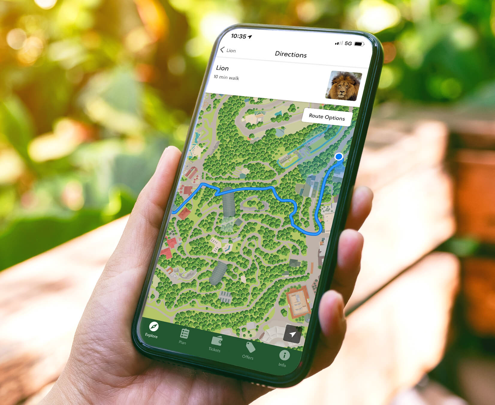 hand holding a phone showing the san diego zoo app