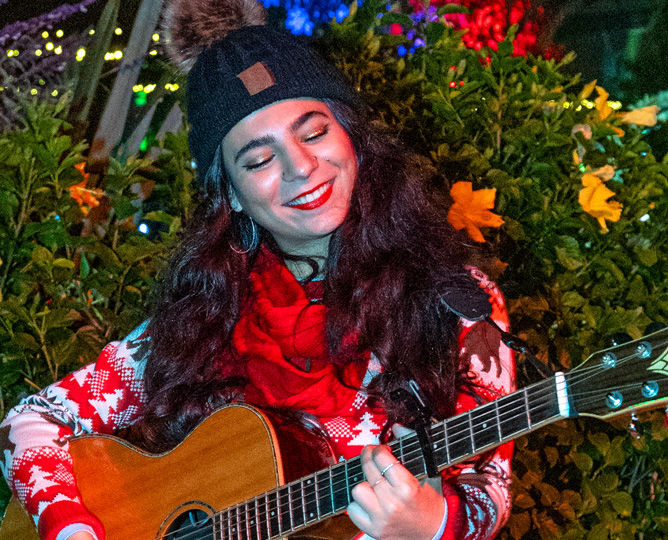 Guitarist with festive songs