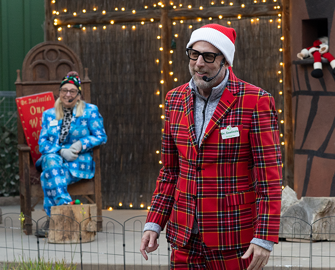 Dr Zoolittle in Christmas wear with microphone