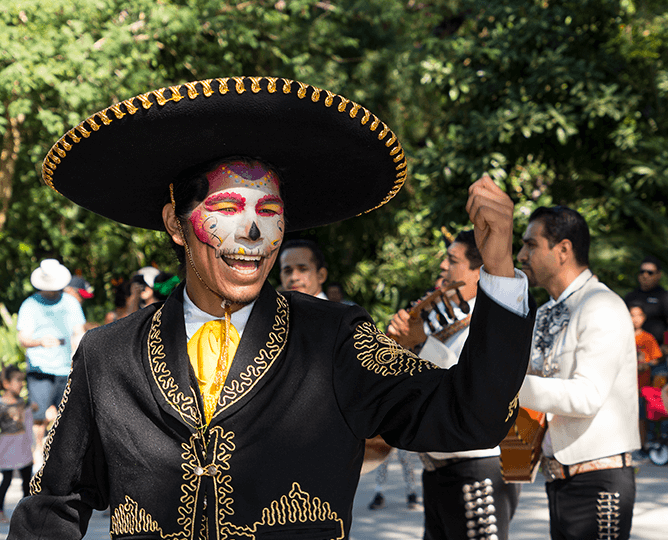 Mariachi singer with Dia de Los Muertos face paint