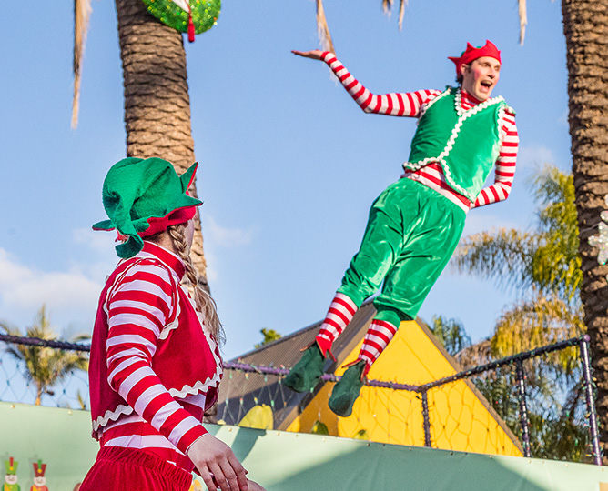 Acrobats in elf costumes