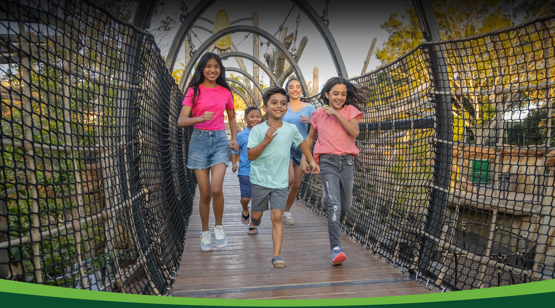 kids running across a bridge