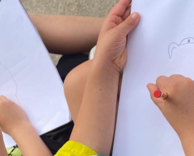 Student drawing a bird